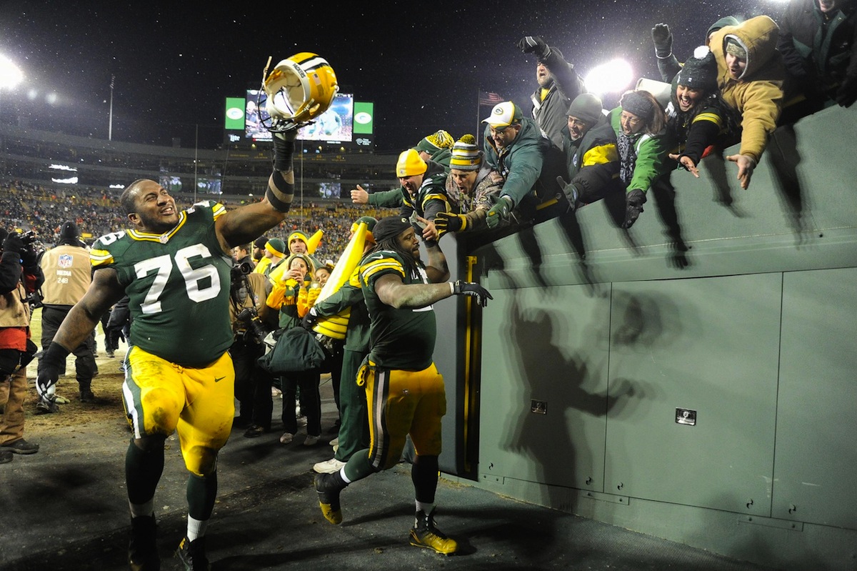 Green Bay Packers defensive lineman Mike Daniels and running back Eddie Lacy celebrate at Lambeau Field by Benny Sieu—USA TODAY Sports.