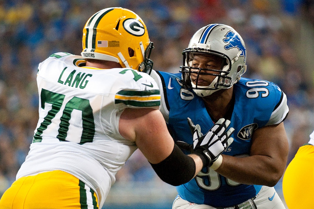 T.J. Lang and Ndomukong Suh by Tim Fuller—USA TODAY Sports.