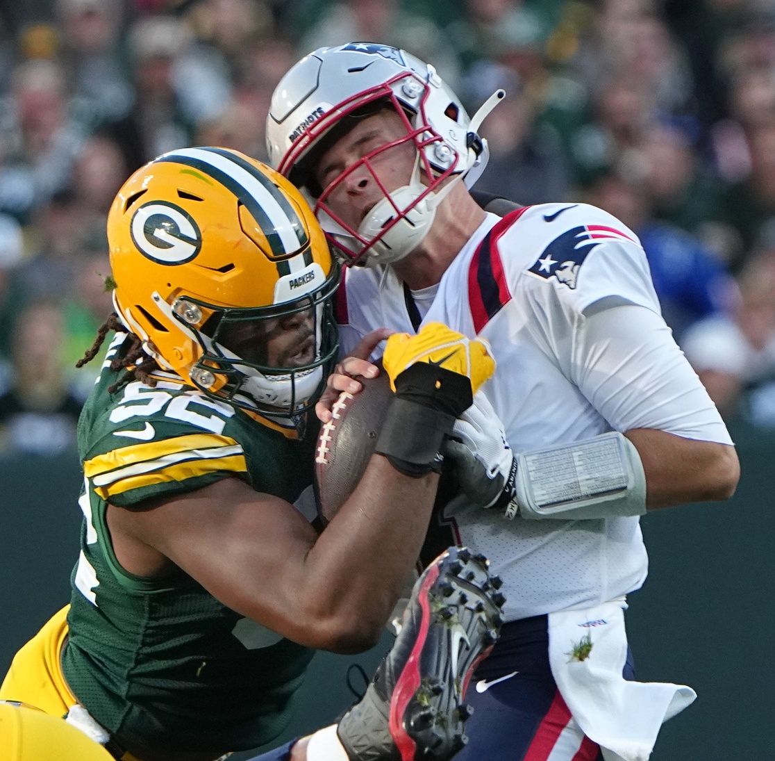 Packers' Rashan Gary sacks Patriots' Bailey Zappe in the Packers 27-24 win.